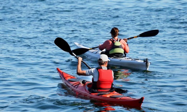 kayakers on lake, best places for kayaking in europe